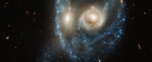 two galaxies colliding creates spooky face in space