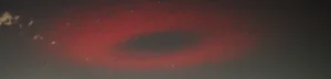 red ufo like halo appears over Italian town